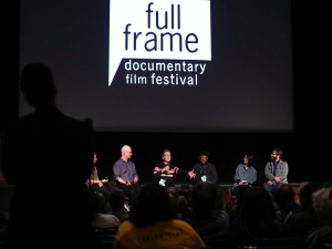 Panelists speak onstage at the Full Frame Documentary Film Festival.